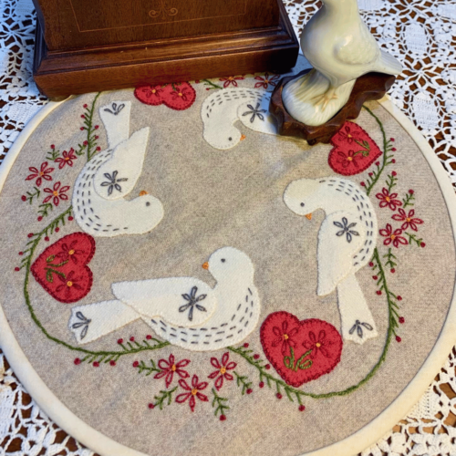 Carried Away Designs linen-colored round table mat with white doves and red hearts