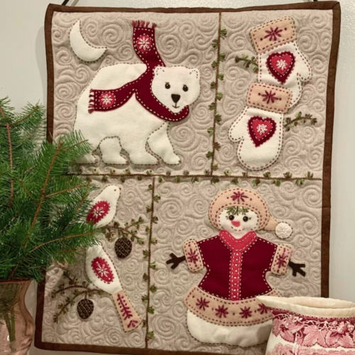 Carried Away Designs linen-colored background with polar bears wall quilt hanging